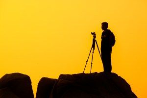 Photographer against a sunset